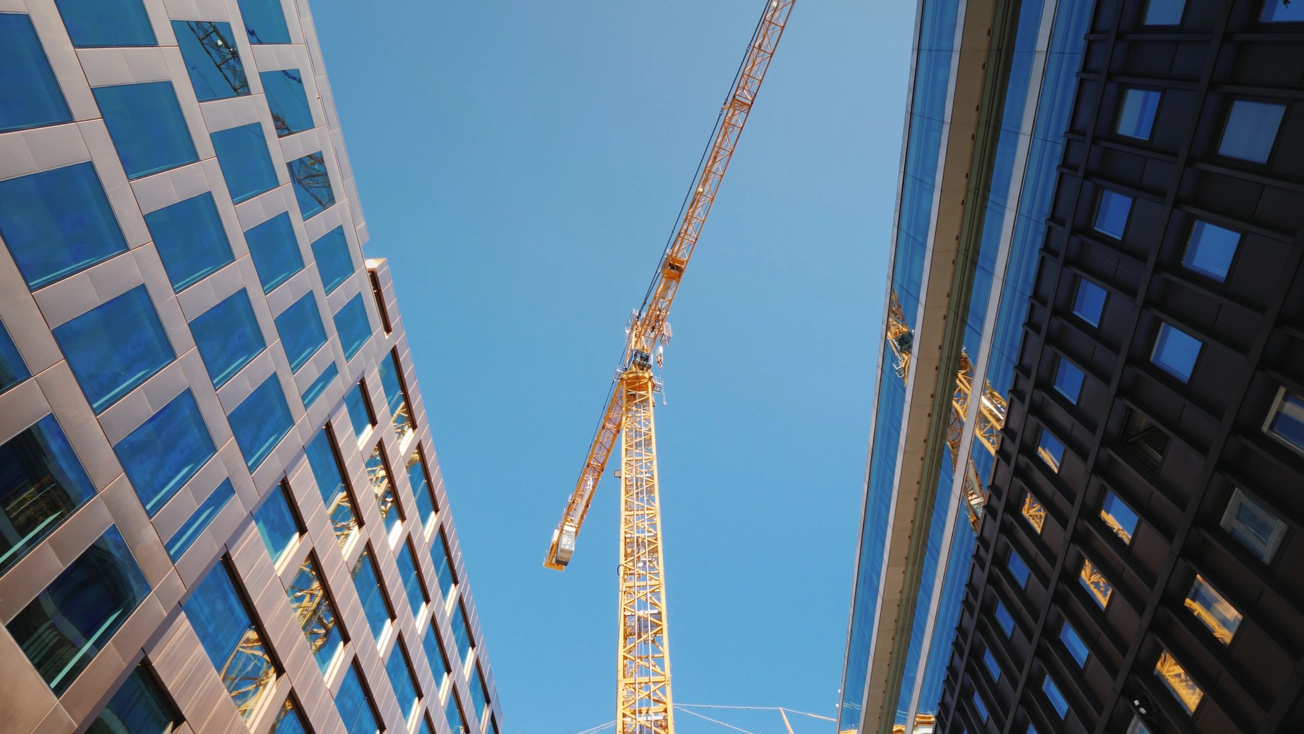 Crane and construction skyline representing project delivery