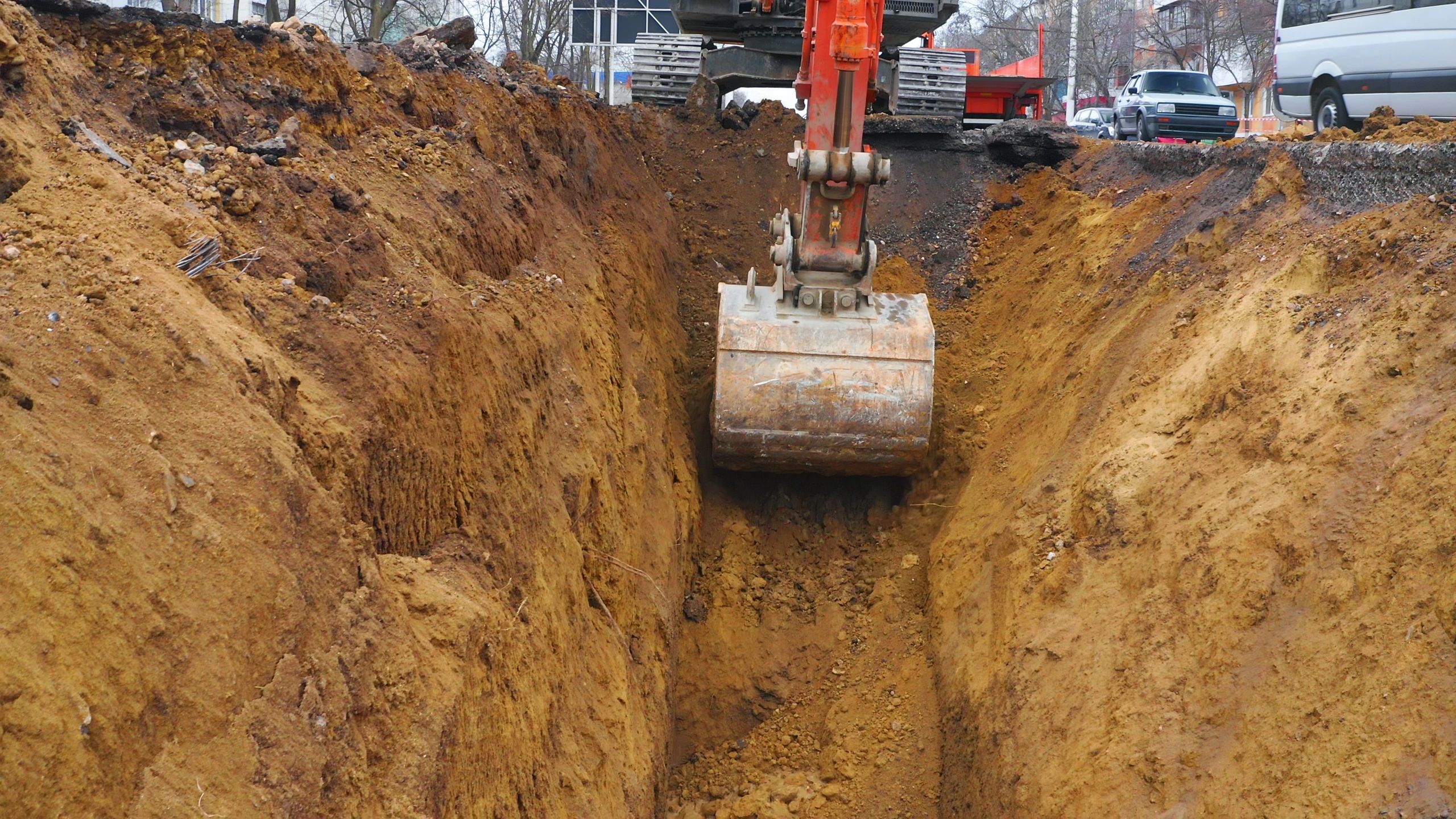 Excavator working on road construction infrastructure project