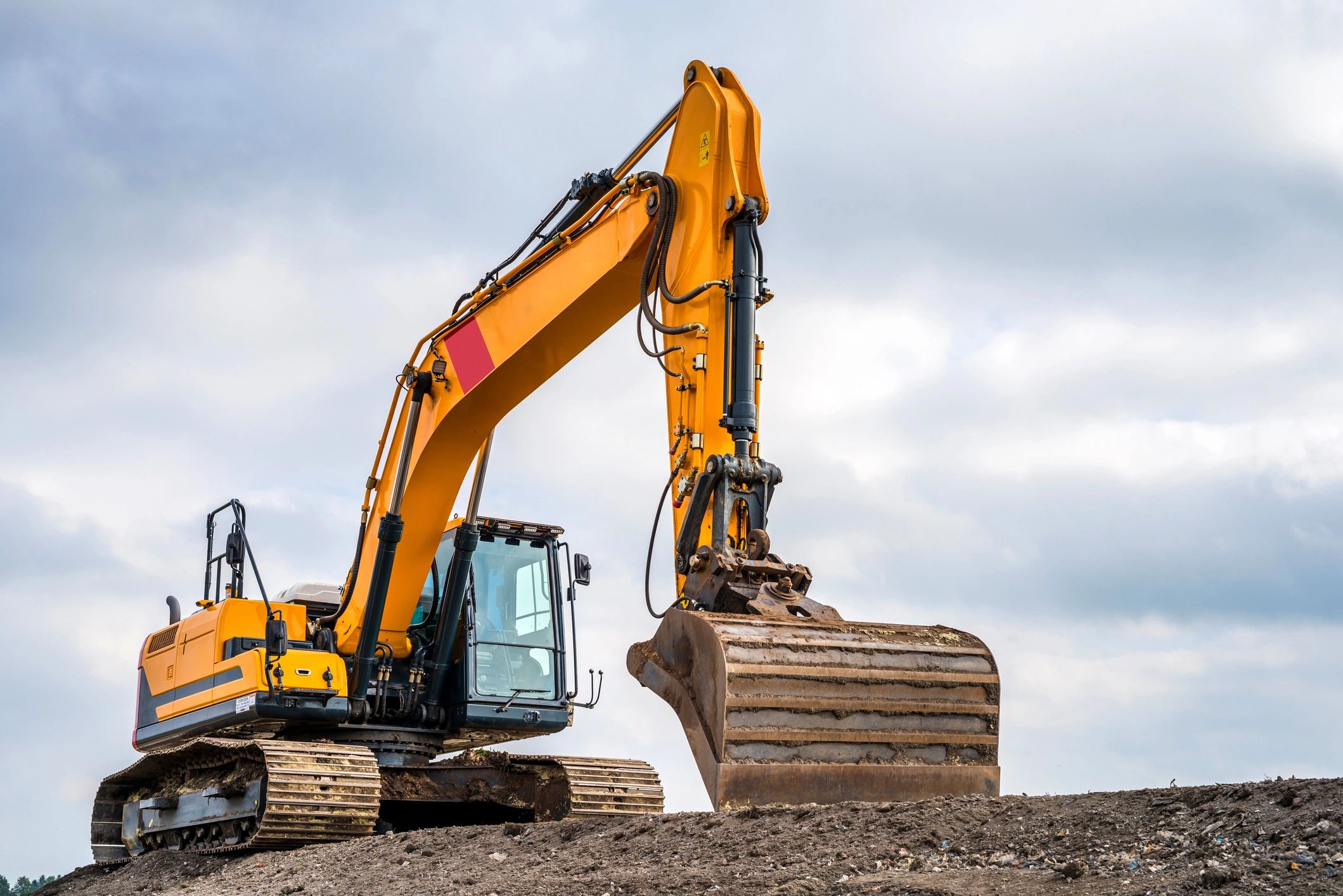 Excavator at a construction site representing heavy equipment operations